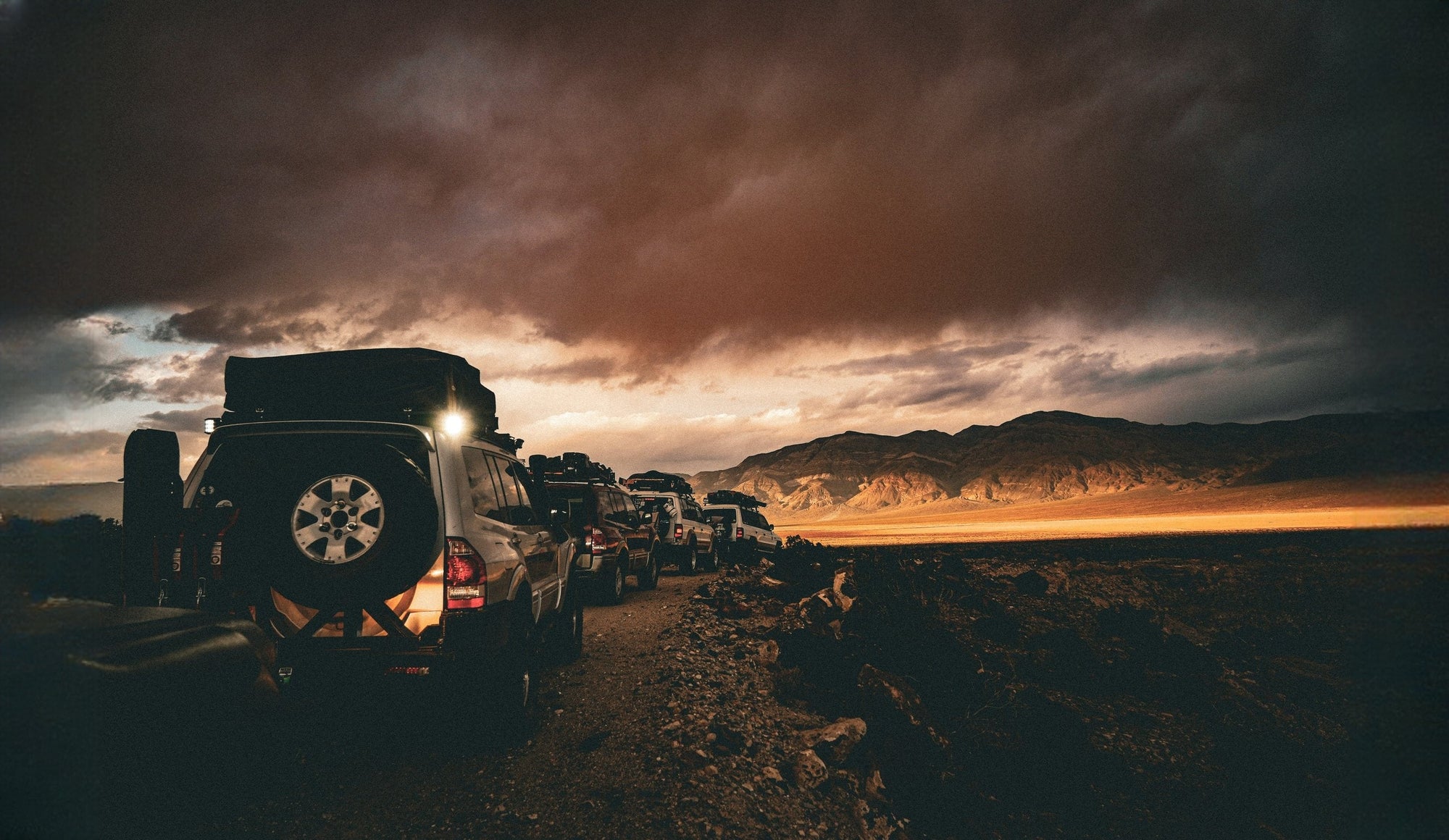 argoing slide convoglio 4x4 tempesta tramonto